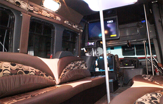 Party bus interior with dance poles